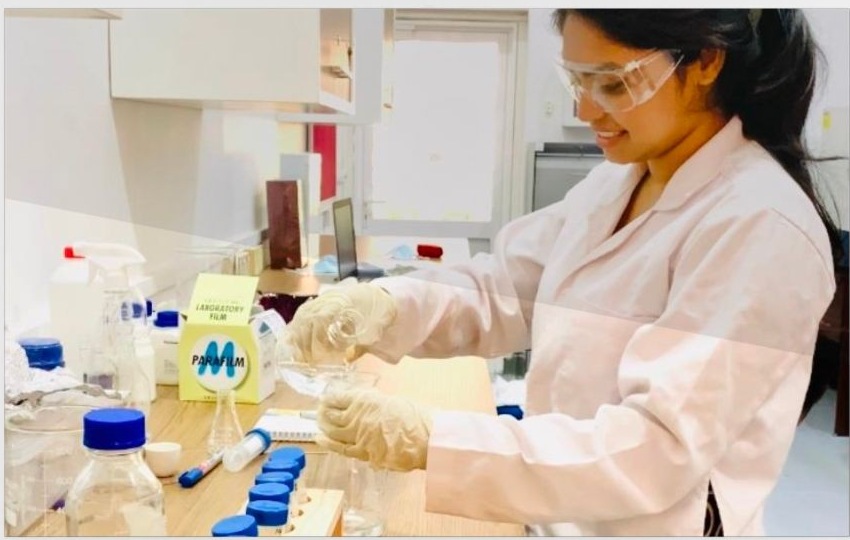 Sanali conducting hands-on research at the laboratory bench