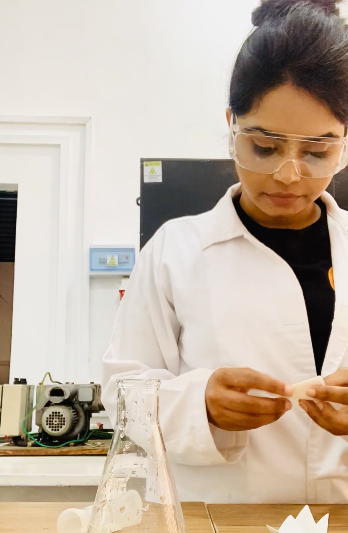 Sanali preparing laboratory materials during PHA research