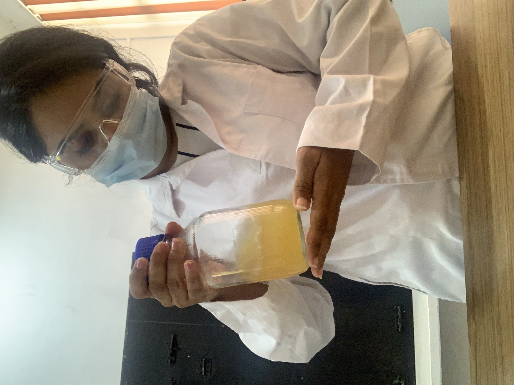 Sanali observing a fermentation vessel during microbial PHA research